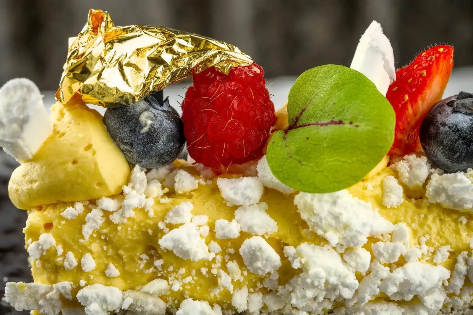The dessert, red berries and gold leaf